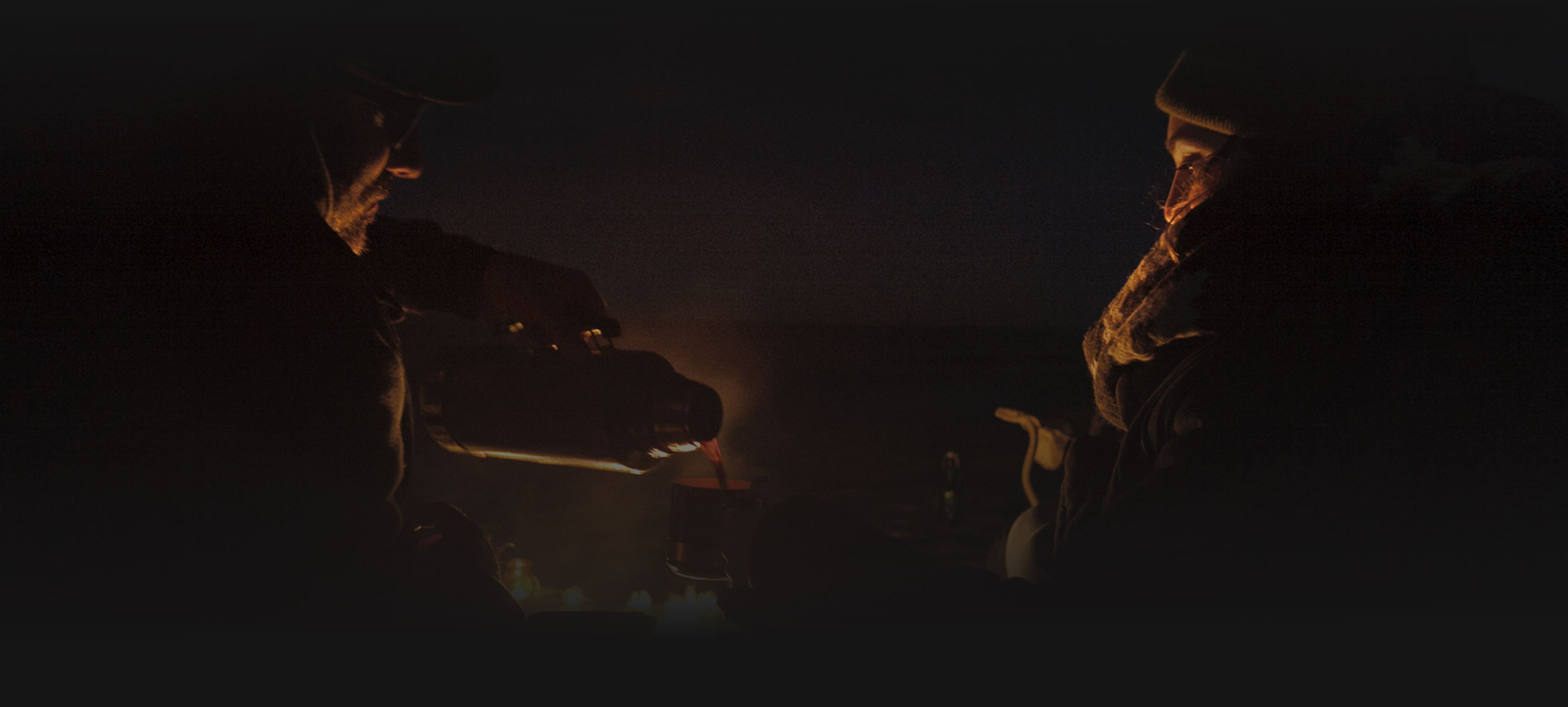 Sharing Some Coffee Around a Camp Fire